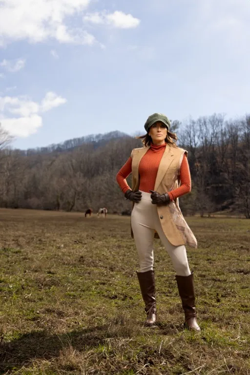 Outdoor portrait of a woman in equestrian gear